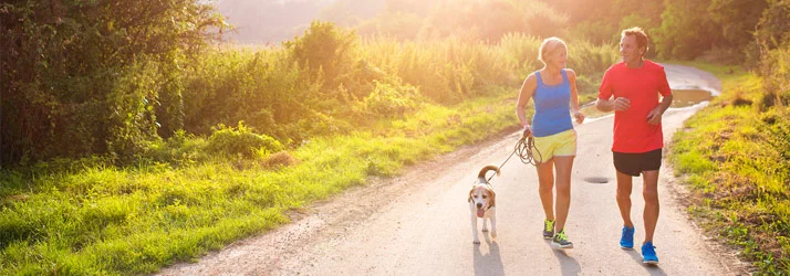 Chiropractic Austin TX Couple Walking Dog